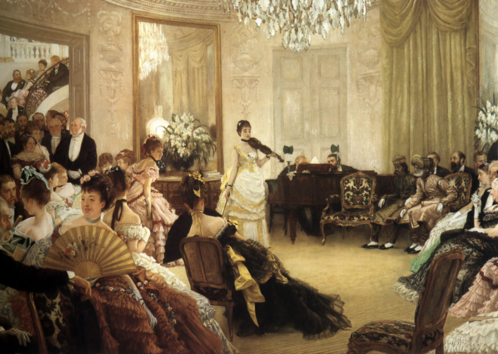 Violinist Wilma Neruda, in a longsleeved pale yellow dress, stands in the front of a salon filled with people, ready to perform.  A spiral staircase on the left is filled with additional audience members, sitting on the steps.