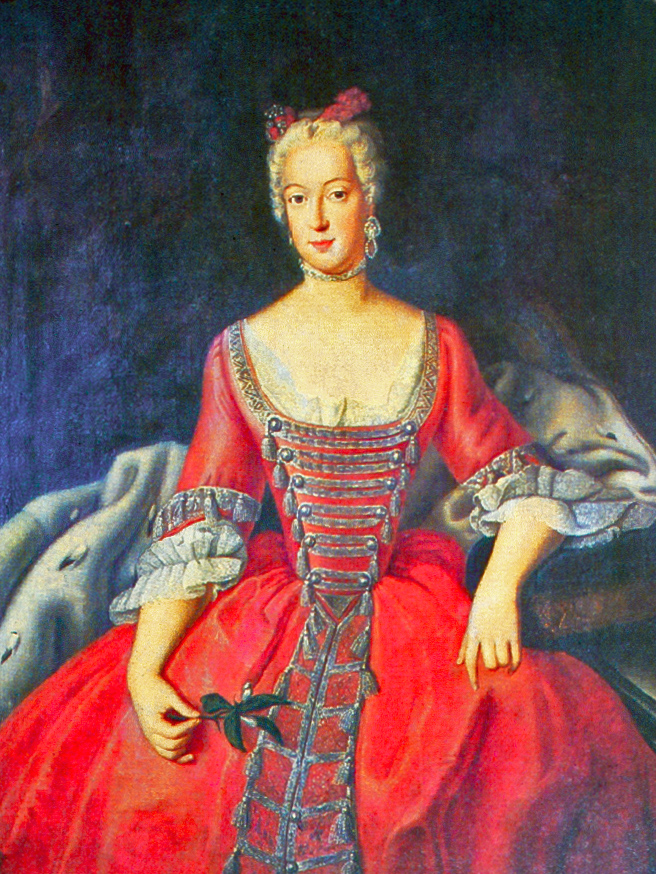 Portrait of Wilhelmine of Bayreuth. Her hair is curled and powdered white, with red ribbons on top that match her dress. The dress has longsleeves and an embroidered trim with tassels. She sits on a chair with a white blanket, and has her left arm propped on the armrest. 