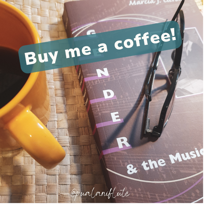 A copy of Marcia Citron's book "Gender and the Musical Canon," with a folded pair of black-framed eyeglasses sitting on top. A yellow mug of coffee sits next to it, half outside the photo's frame.  White letters in a turquoise label read: "Buy me a coffee!"